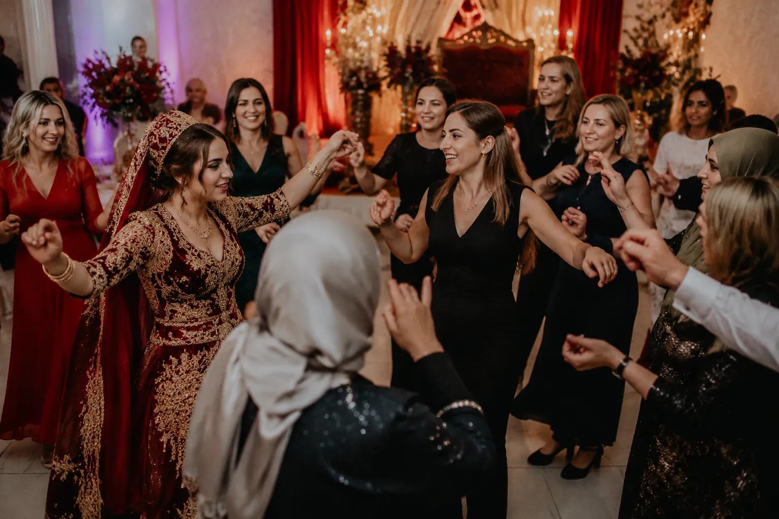 Wedding guests joining an invitation-led group dance at a henna night